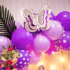 A combination of purple pastel, purple latex, purple polka dots, and purple chrome balloons makes the space look aesthetic.