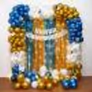 A shimmery frill of gold and blue accents adorns the backdrop, creating a breathtaking skyline for your grand anniversary celebration.