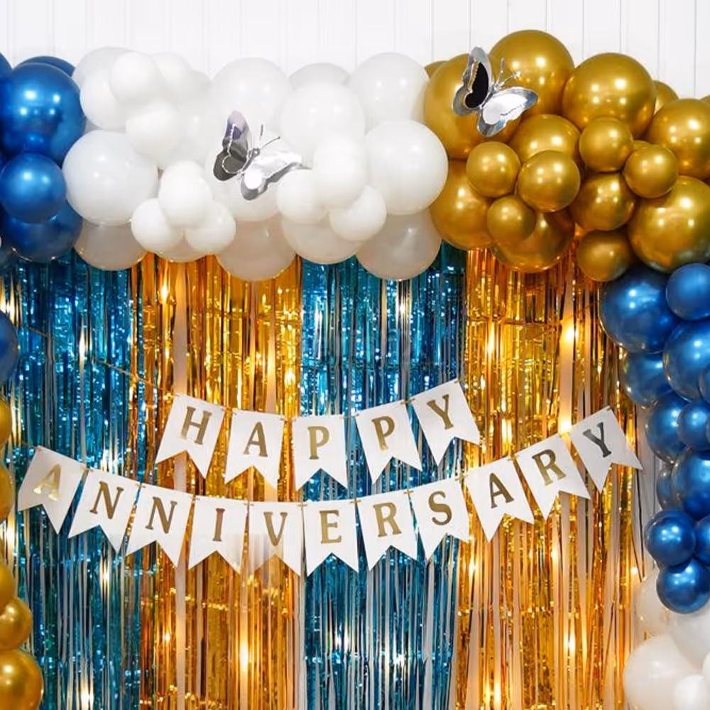 Intricately designed frill drapes in golden hues create an opulent and sophisticated atmosphere, enhancing the allure of your anniversary celebration.