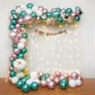 This decor is a blend of a symphony of White, Green, and Pink balloons.
