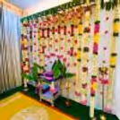Natural flower garlands with ganeru flower hangings add a touch of tradition