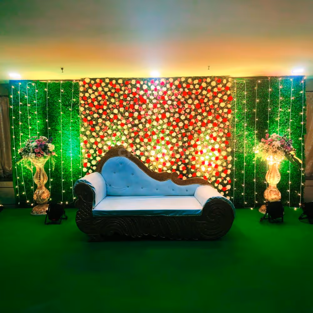 A mesmerizing flower wall backdrop adorned with Carnations, Krisanthmam, and Roses.