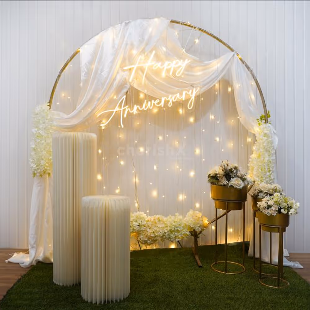 Ignite the spark of romance and nostalgia as you enter a realm adorned with white satin fabric and cosy "Happy Anniversary" neon light.