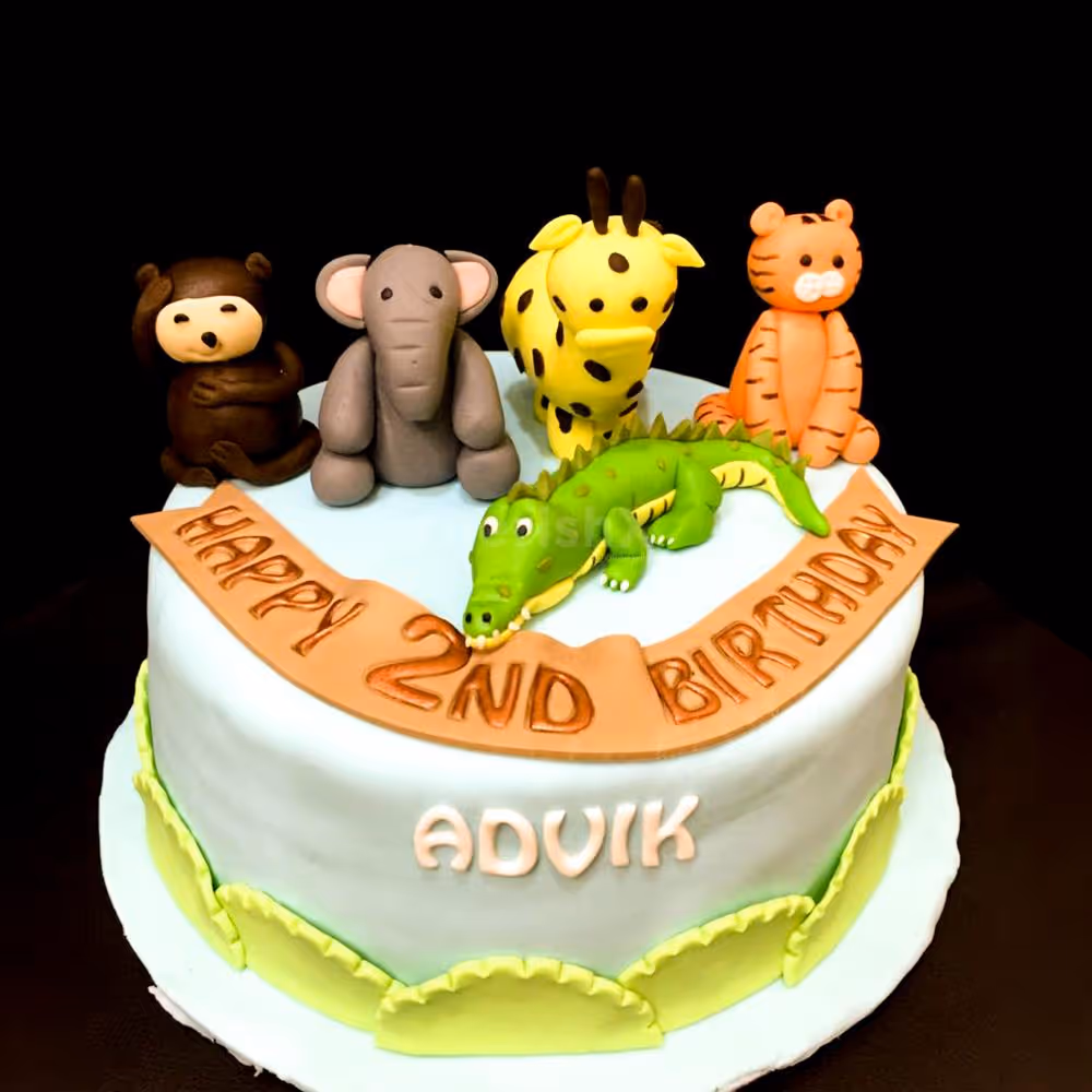Our Animal Theme Fondant Cake features charming sculpted animal figures, adding a touch of enchantment to the celebration.