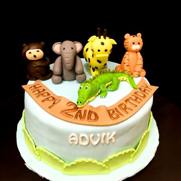 Our Animal Theme Fondant Cake features charming sculpted animal figures, adding a touch of enchantment to the celebration.