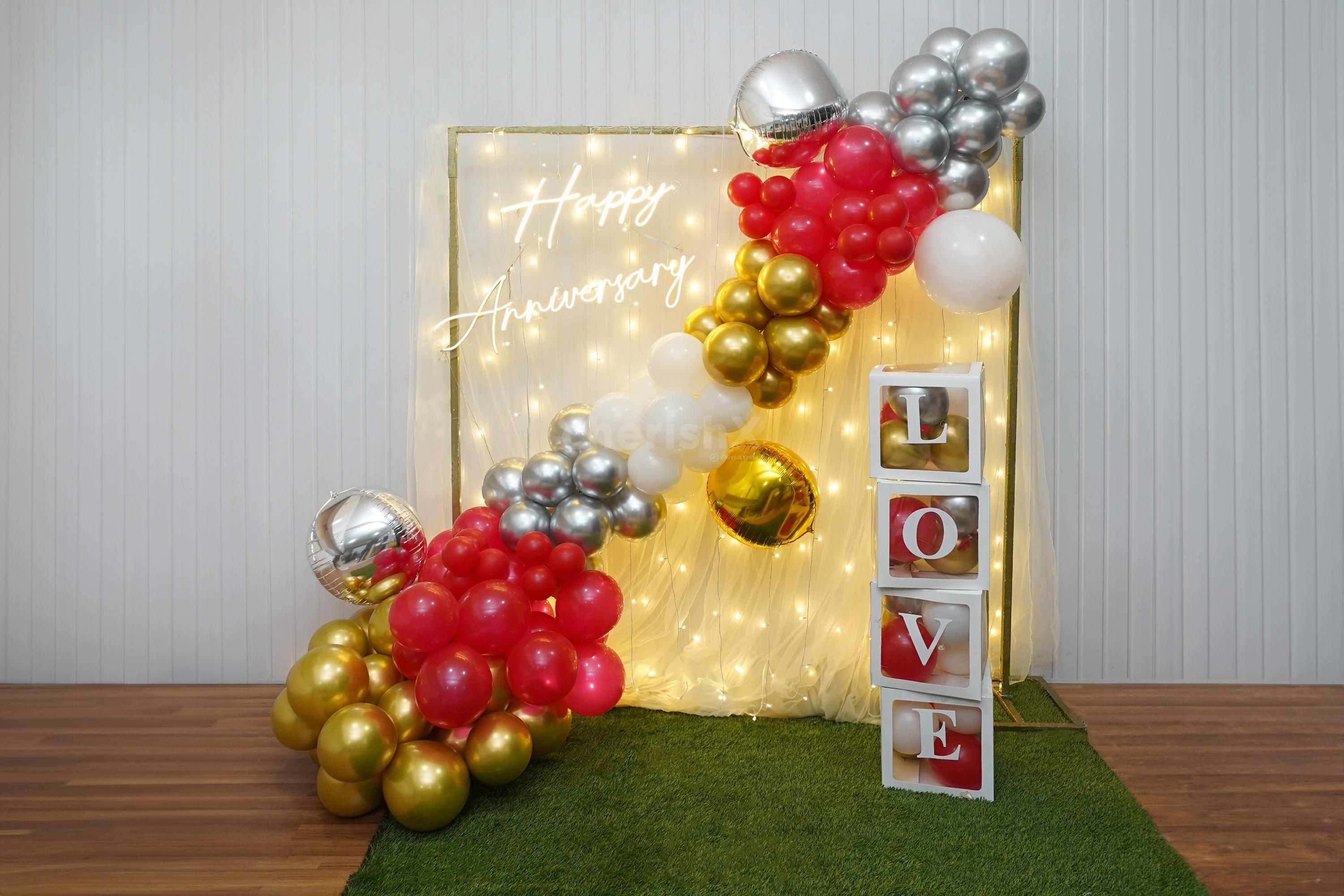 Pixel Lights, Red Carpet, and Love-Filled Balloon Arrangements Give a Captivating Look.