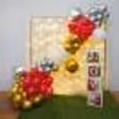 Pixel Lights, Red Carpet, and Love-Filled Balloon Arrangements Give a Captivating Look.