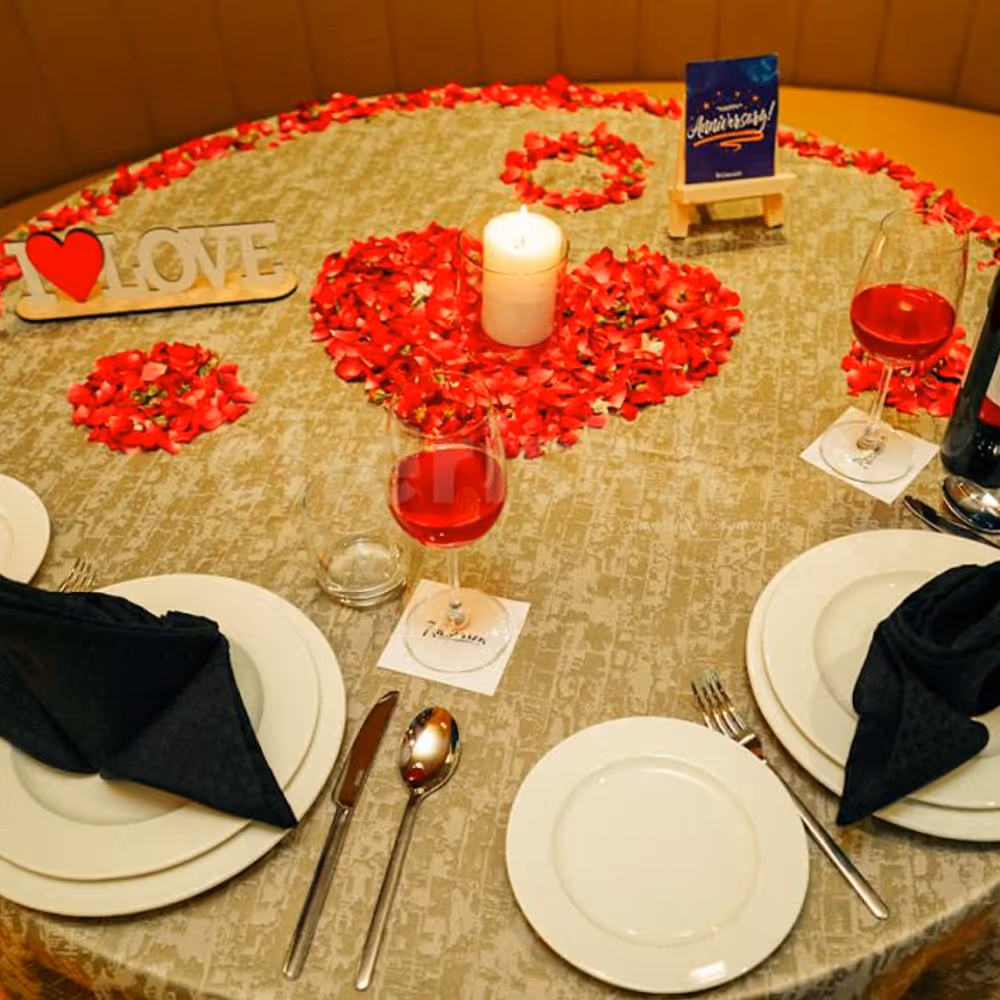 Enter a space adorned with artistic candles and flower petals.