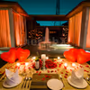 Step into a world of enchantment as you dine by the fountain's edge, surrounded by heart-shaped balloons and the soft glisten of candlelight.