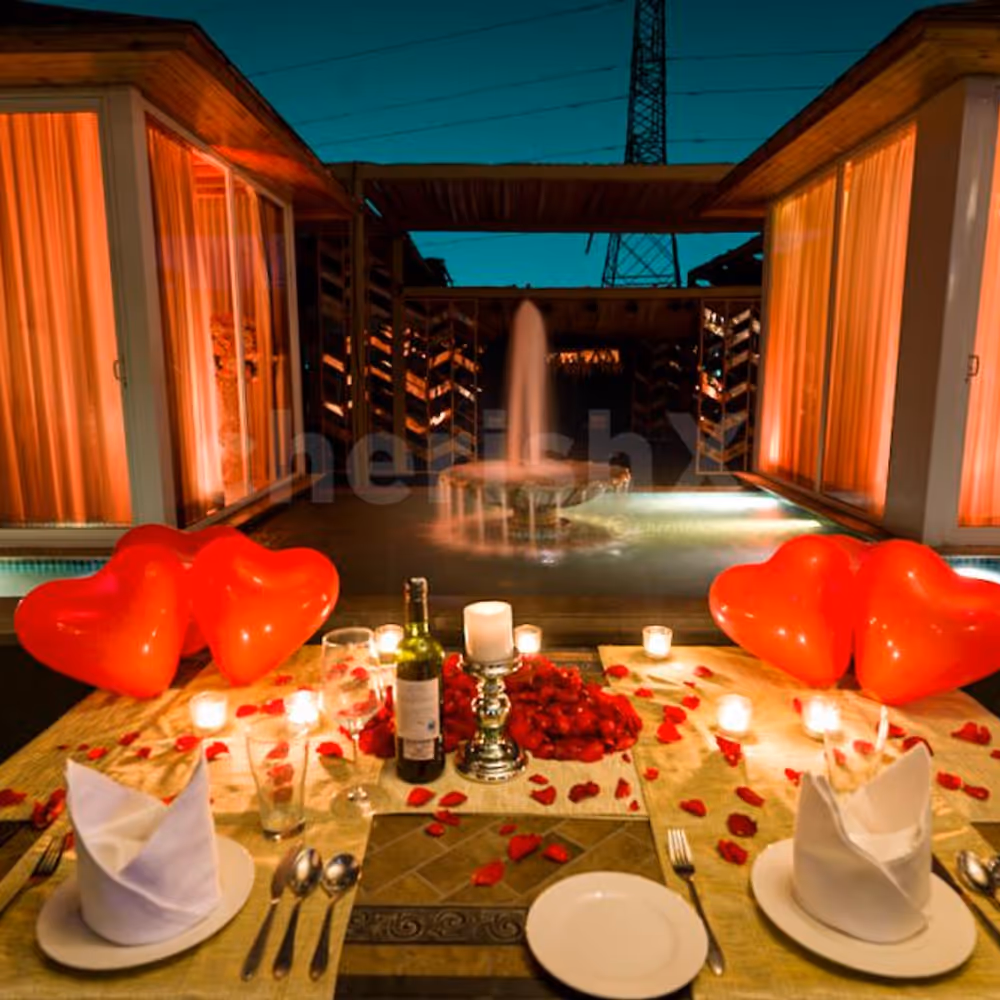 Step into a world of enchantment as you dine by the fountain's edge, surrounded by heart-shaped balloons and the soft glisten of candlelight.