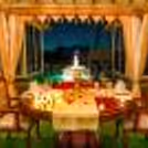 A tranquil oasis awaits, adorned with flickering candles, heart-shaped balloons, and the soft melody of fountains.