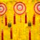 A rectangular stand draped with yellow garlands forms a backdrop for your celebrations.