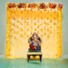 Immerse in divine elegance as your home resonates with the enchanting charm of our Flower and Tassel Ganpati Decorations.
