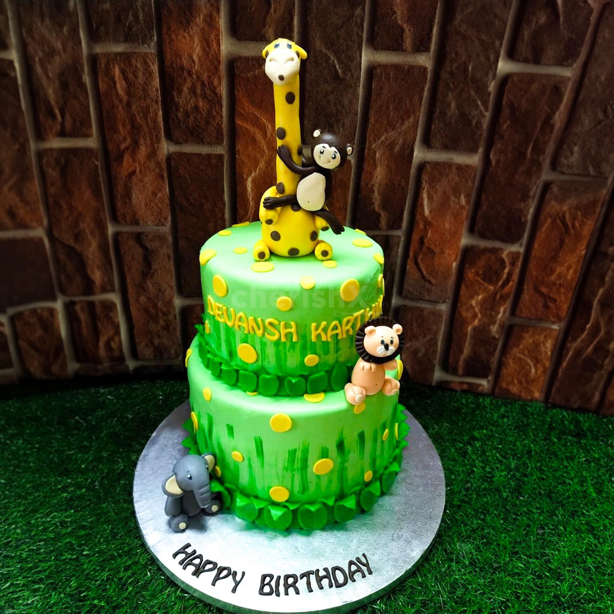 Prepare to be whisked away on an exhilarating jungle adventure with our captivating Giraffe Jungle Theme Two Tier Fondant Cake.