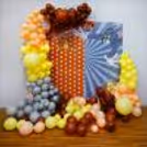 Our playful backdrop and balloon arch create the perfect setting for a memorable birthday party.