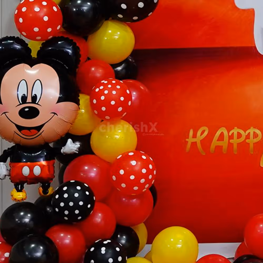 The party setup includes a stunning backdrop flex that sets the stage for memorable photos and cherished moments.