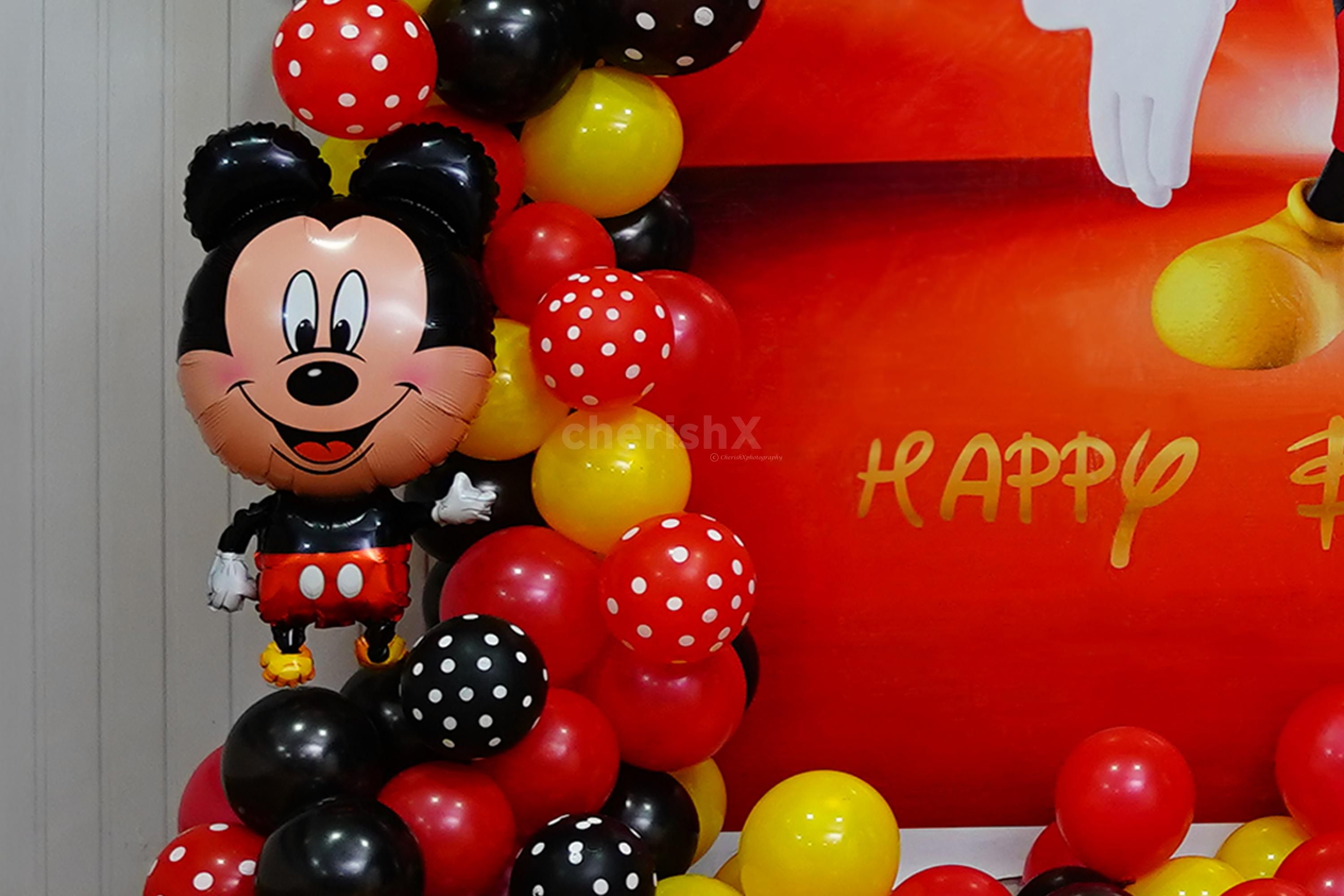 The party setup includes a stunning backdrop flex that sets the stage for memorable photos and cherished moments.