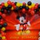 Picture-perfect setting with Mickey Mouse foil balloon and silver digit foil balloon.
