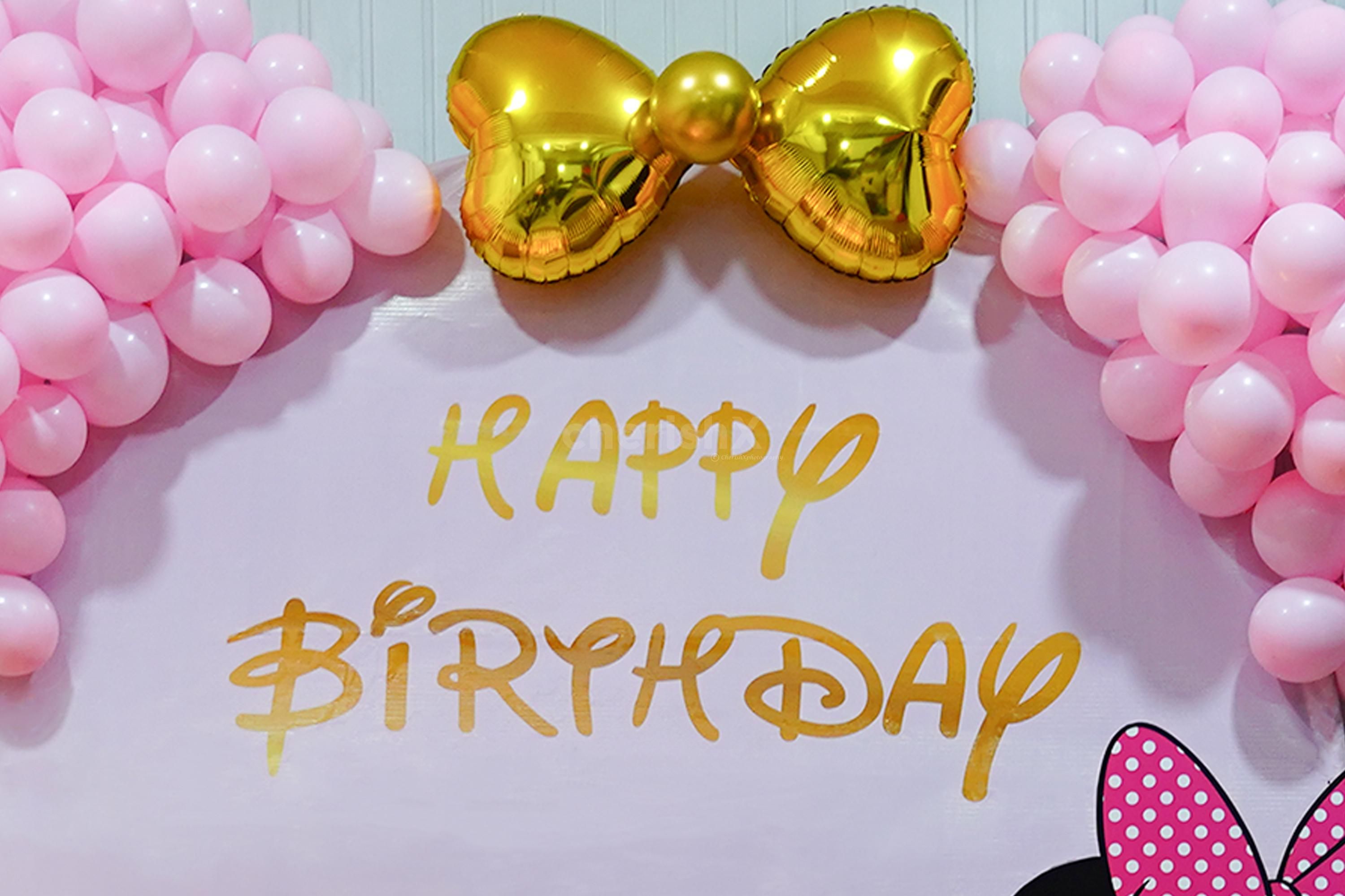 A space adorned with pink pastel balloons