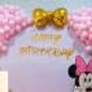 Golden chromes and heart-shaped foil balloons shimmer with delight.