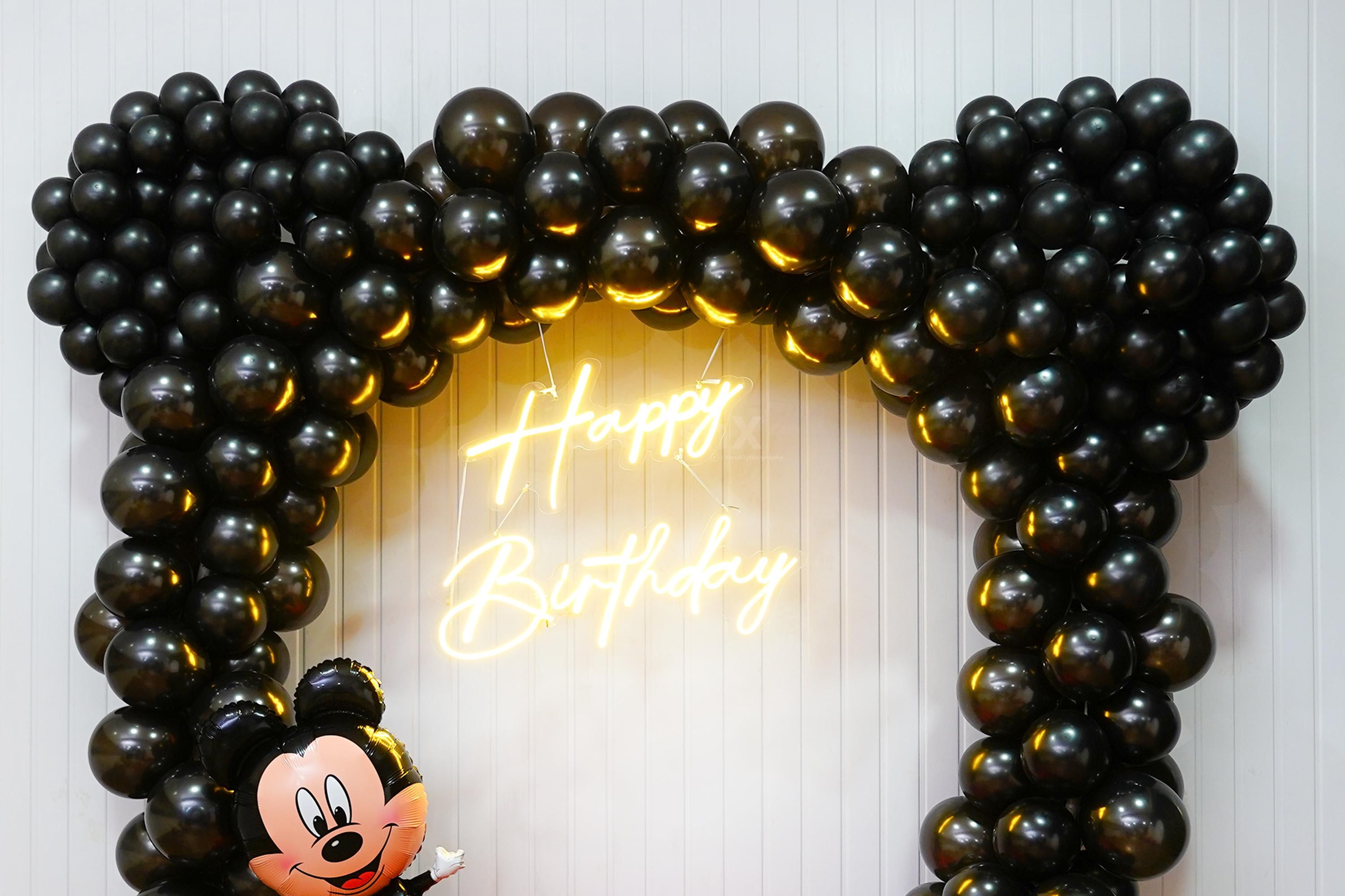 The set-up is arranged in black metallic and red latex, every element promises to make the celebration truly extraordinary.