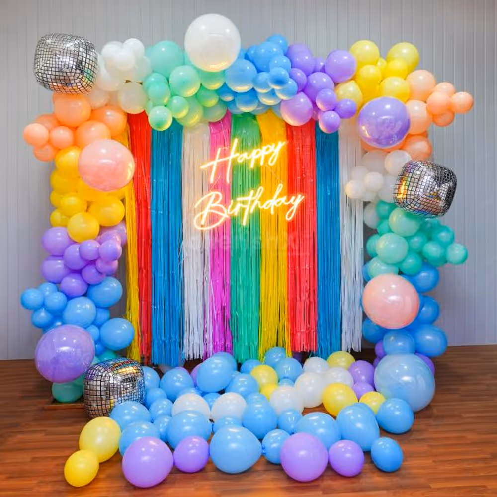 Transform Any Space with Our Neon-Lit Backdrop and Rainbow Arch Balloons.