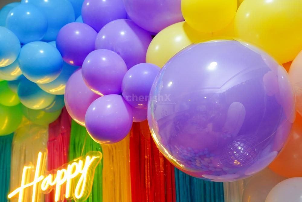 Create an Unforgettable Moment with our Tailored Rainbow Birthday Decoration.