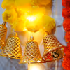 Vibrant yellow and orange marigold garlands with LED lights.
