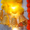 Vibrant yellow and orange marigold garlands with LED lights.