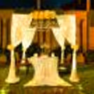 Romantic cabana decor enchants you with soft white drapes, twinkling fairy lights, fragrant blooms, and the warm glow of candles.