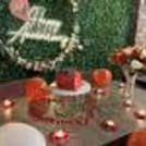 Soft Music, Balloons, Flowers, and Glistening Candles Set the Mood.