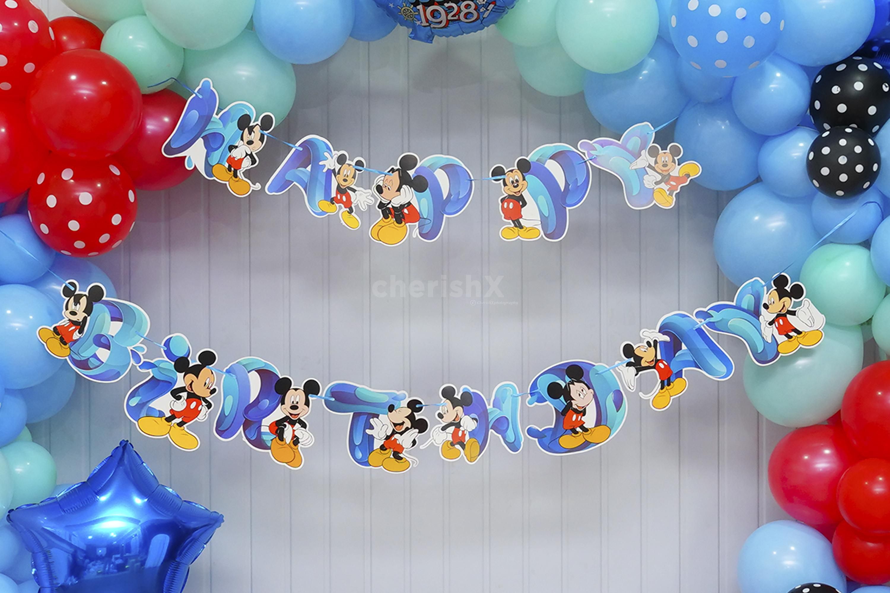 Let the 140 balloons, from serene pastel blues to playful black polka dots, paint a picture of celebration.