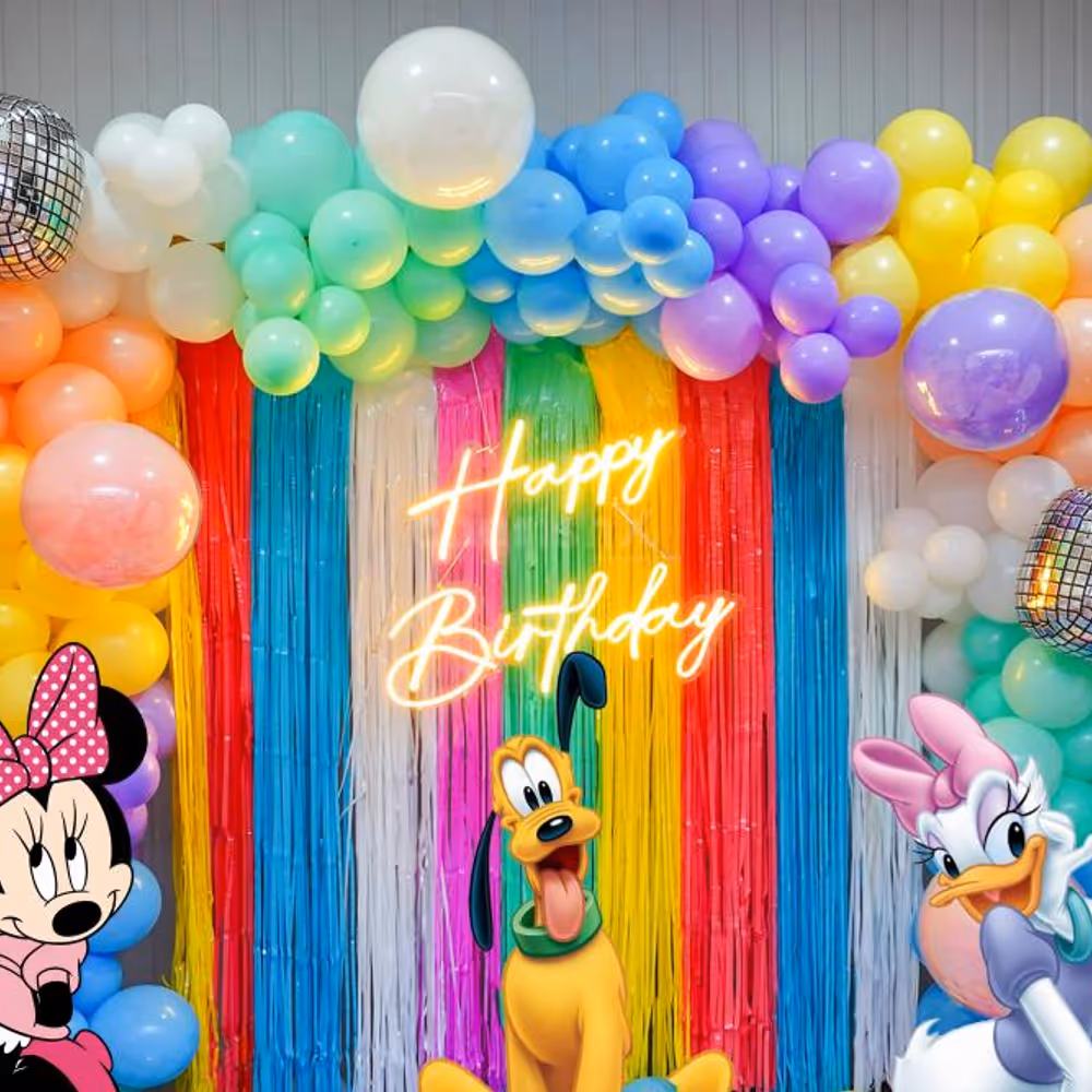 Elevate the Celebration with Vibrant Balloon Arches and Playful Frill Curtains.