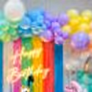 Create Unforgettable Moments with Big Macron Balloons and Sunboard Cutouts.
