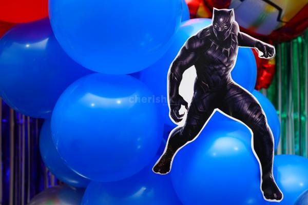 Immerse in the World of Heroes with Avenger Symbols and Free-Floating Balloons.