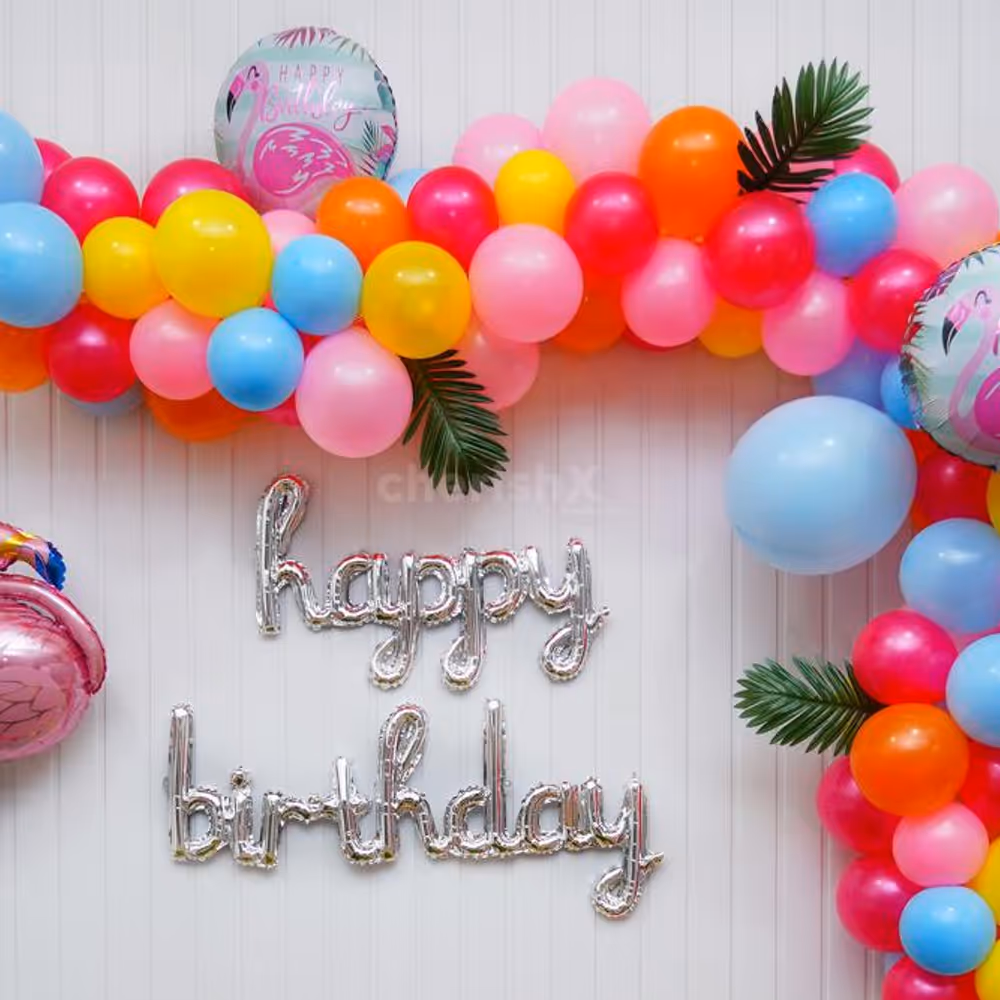 Elevate the Celebration with a Balloon Arch Bursting with Yellow, Blue, and Magenta Hues.