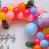Let the Birthday Shine with a Silver Cursive Foil Balloon Amidst the Flamingo-Themed Decor.