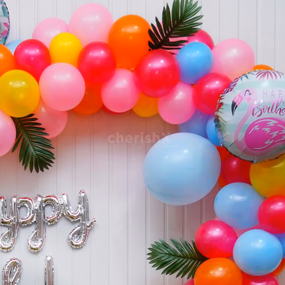 Let the Birthday Shine with a Silver Cursive Foil Balloon Amidst the Flamingo-Themed Decor.