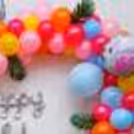 Let the Birthday Shine with a Silver Cursive Foil Balloon Amidst the Flamingo-Themed Decor.