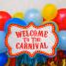 Let the Birthday Shine with a Happy Birthday Foil Balloon Amidst Carnival Magic.