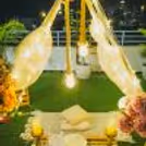 Low dining tables, wooden candle stands, and cosy mats with cushions set the perfect scene for a romantic evening.