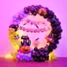 These black, purple, and eerie light green balloons will send shivers down your spine this Halloween.