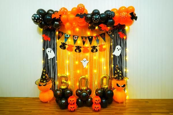 Eerie Charm Awaits With Orange Metallic Balloons and Frill Curtains