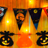 Embrace Halloween with Pumpkin Bunting and Ghost Paper Cutouts.