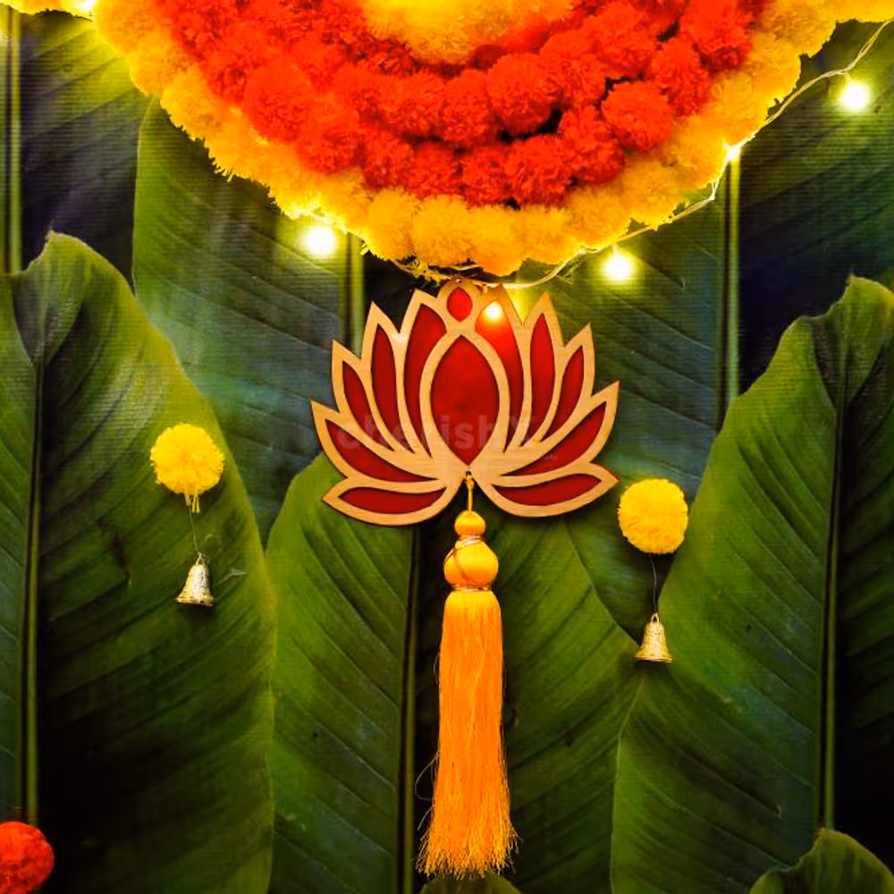 Breathe in the enchanting aroma of green pan strings and celebrate with vibrant orange and yellow garlands.