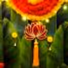 Breathe in the enchanting aroma of green pan strings and celebrate with vibrant orange and yellow garlands.