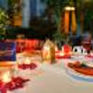 Beautifully decorated garden dining table with flowers and candles at Hyatt Place.