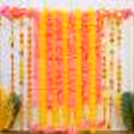 Elevate your festive decor game with our all-in-one Royal Garland Diwali Puja Backdrop Kit with a rectangular stand, pink and yellow garlands with tassels, and more.