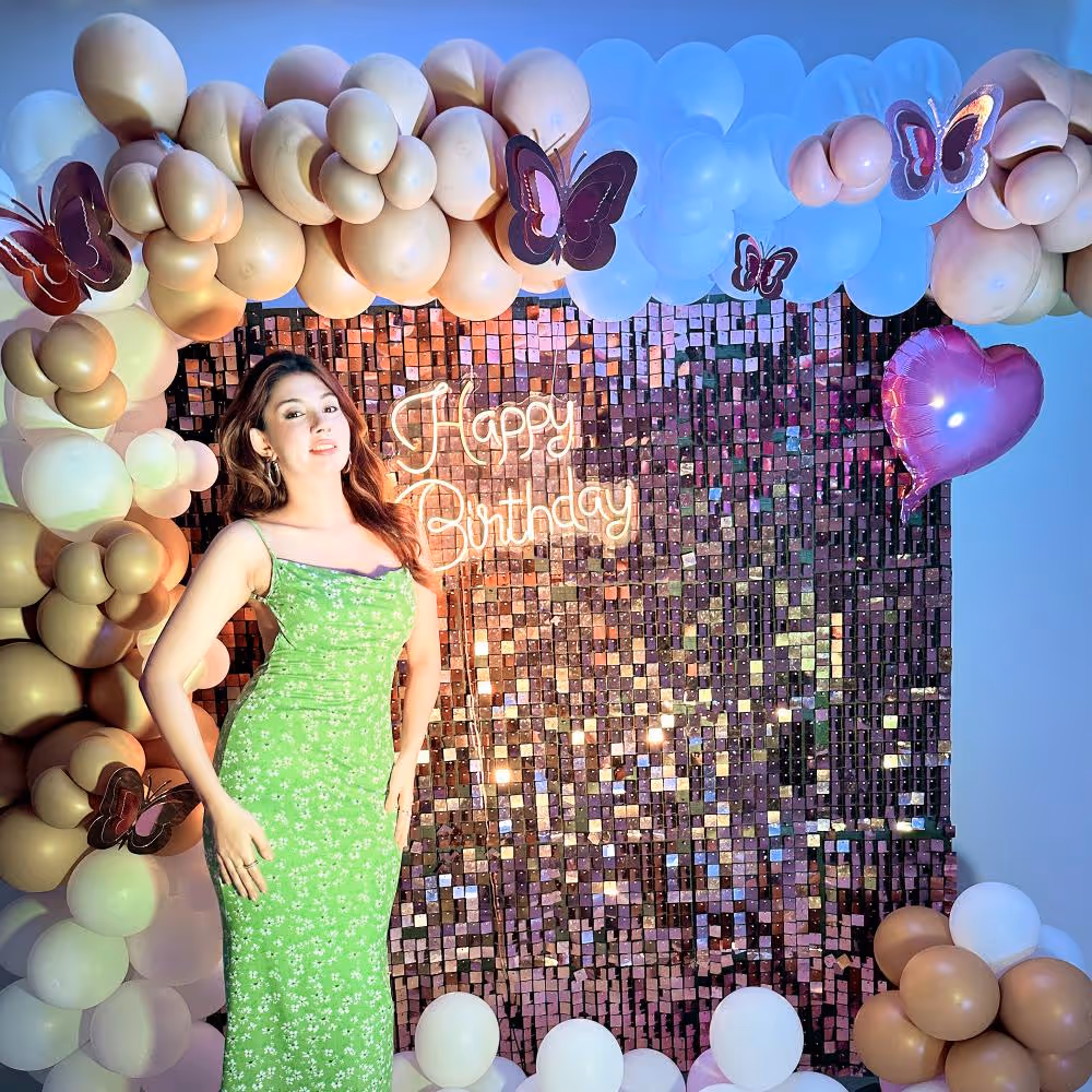 Golden chrome balloons and elegant white latex balloons dance in the air, creating an atmosphere of pure delight.