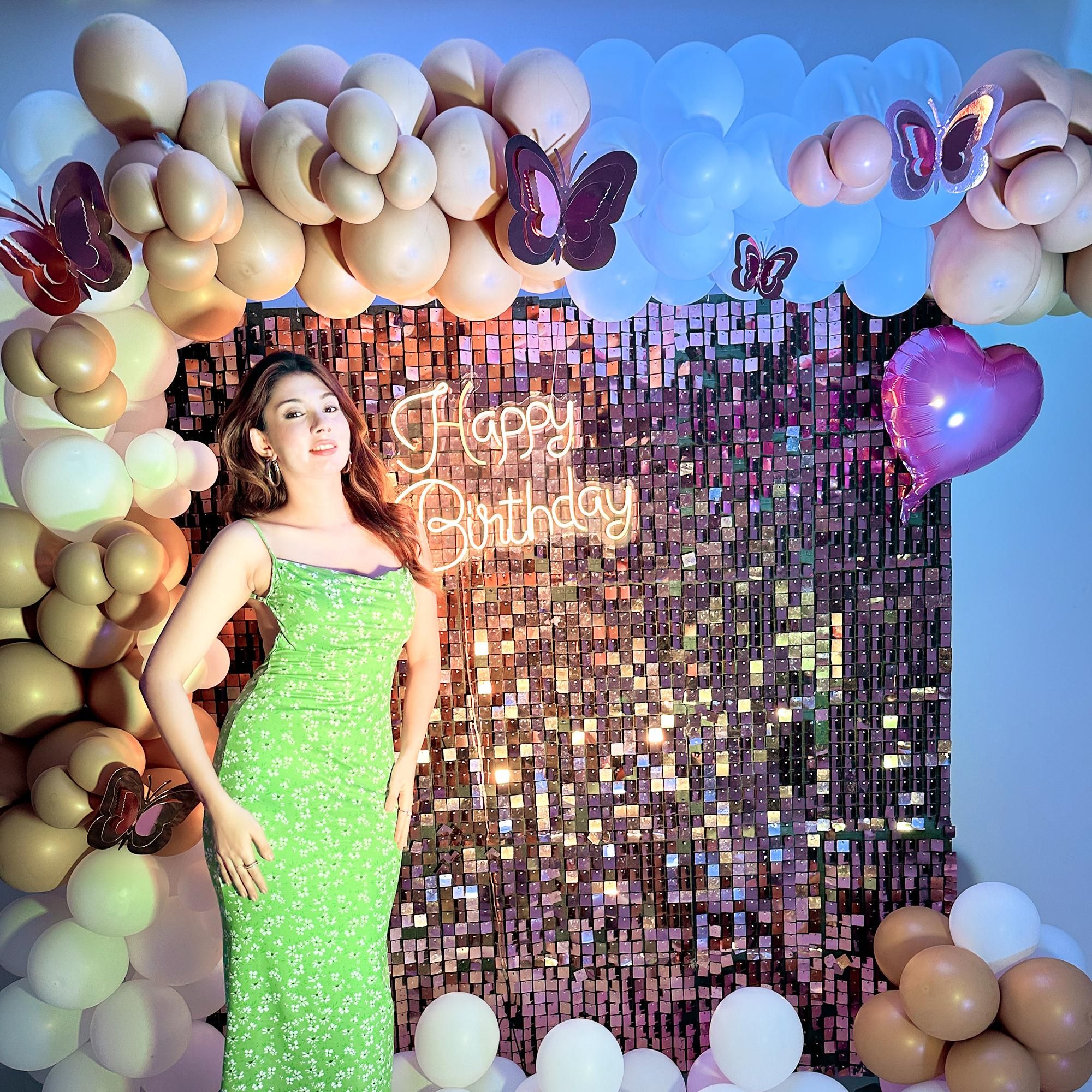 Golden chrome balloons and elegant white latex balloons dance in the air, creating an atmosphere of pure delight.